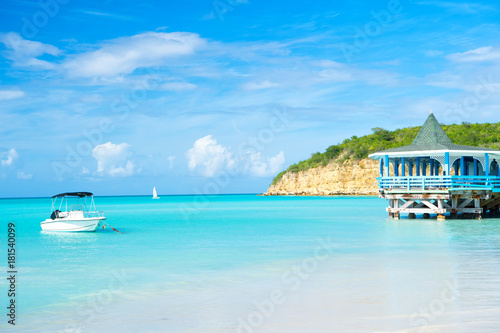 Sea beach with boat and shelter in st johns, antigua © be free