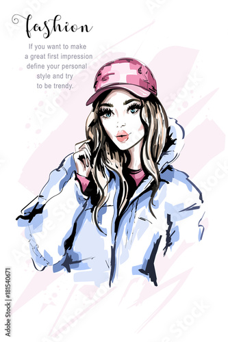 Hand drawn beautiful young woman portrait. Fashion woman in cap. Stylish cute girl with long hair. Fashion model in winter clothes. Sketch.