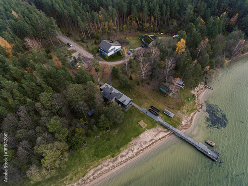 Aerial view over big lake Dusia in Lithuania, during cloudy Autumn day. photo