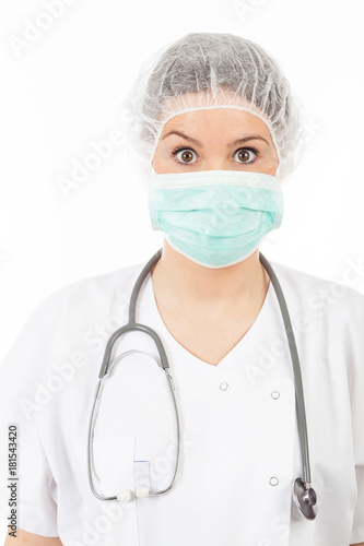 young woman doctor with stethoscope and mask