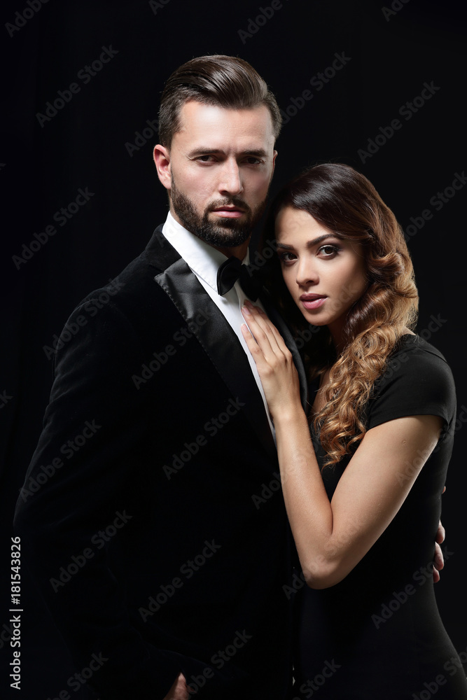 portrait of fashion couple on black background portrait of fashion couple on black background
