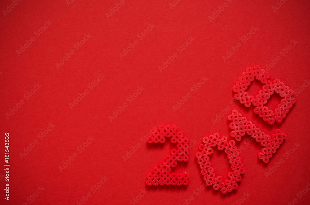 2018 made from mini bead ornament isolated on red background with space for text.Concept New Year 2018.Top view. Flat lay.