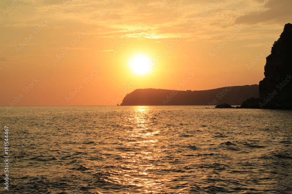 Beautiful sunset, rocky coast of Cape Fiolent. Dramatic scene. Crimea