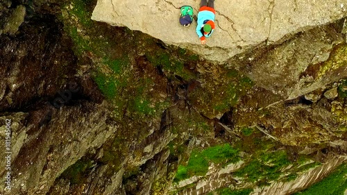 Trolltunga. Norway. girl sitting on the edge of the Trolltunga. aerial vie. beautiful landscape of Norway