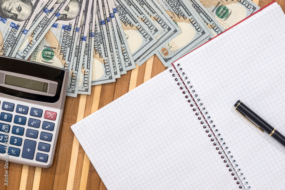blank notepad with pen, dollar and calculator blank notepad with pen, dollar and calculator