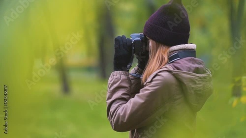 beautiful twoman tourist travel photographer photographing forest at autumn day photo