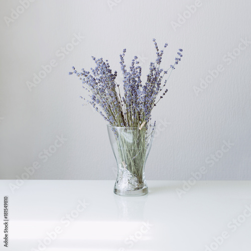 Lavender in glass vase on the white table