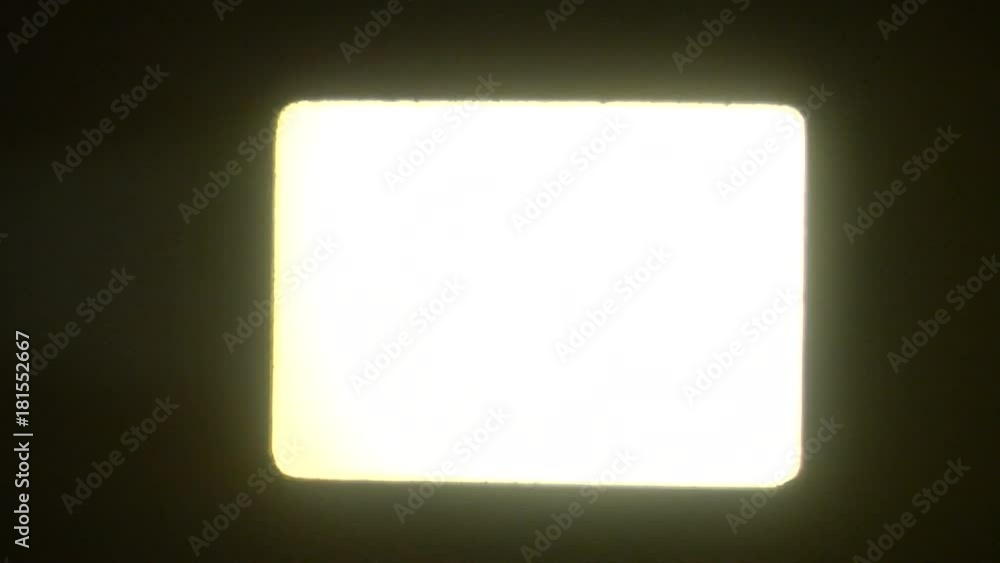 Close up, screen lit up by film projector Close up, screen lit up by film projector