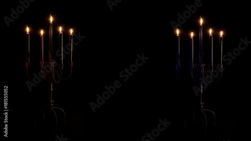 Close up, dueling candelabras burn photo
