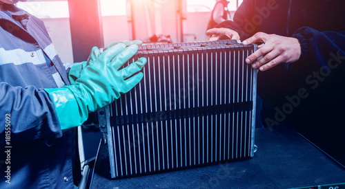 Charging the batteries of the elecric motor. Disassembling the battery of an electric vehicle engine photo