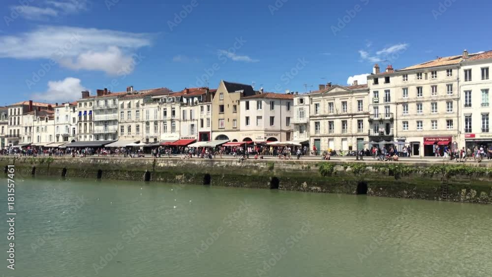 Main street on La Rochelle with busy restaurants and shops Main street on La Rochelle with busy restaurants and shops