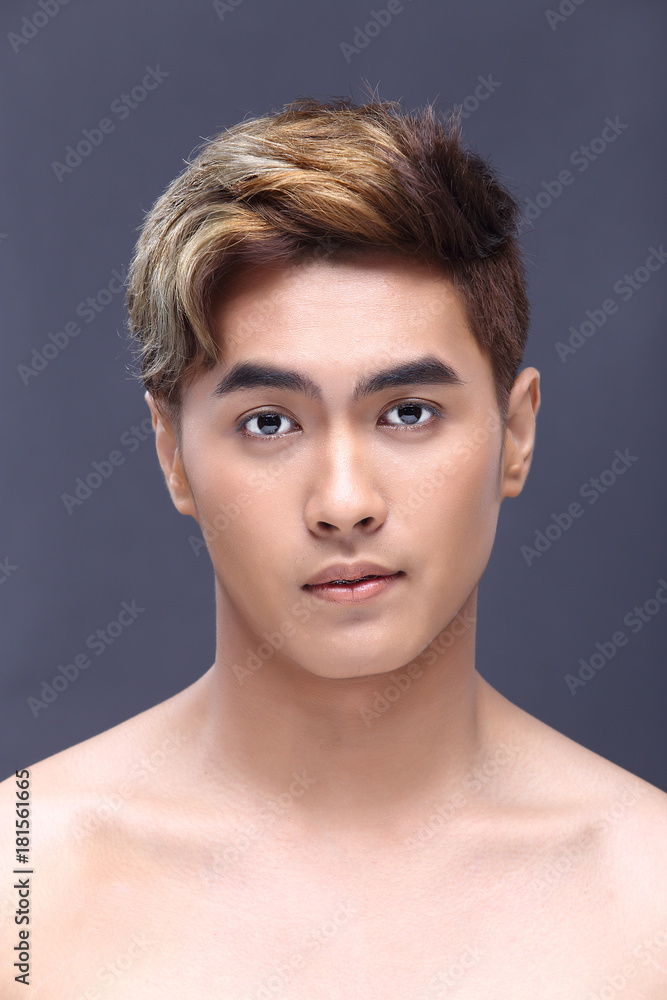 Fototapeta premium Man sexy face topless male model with Different Shading beautiful Color Hair