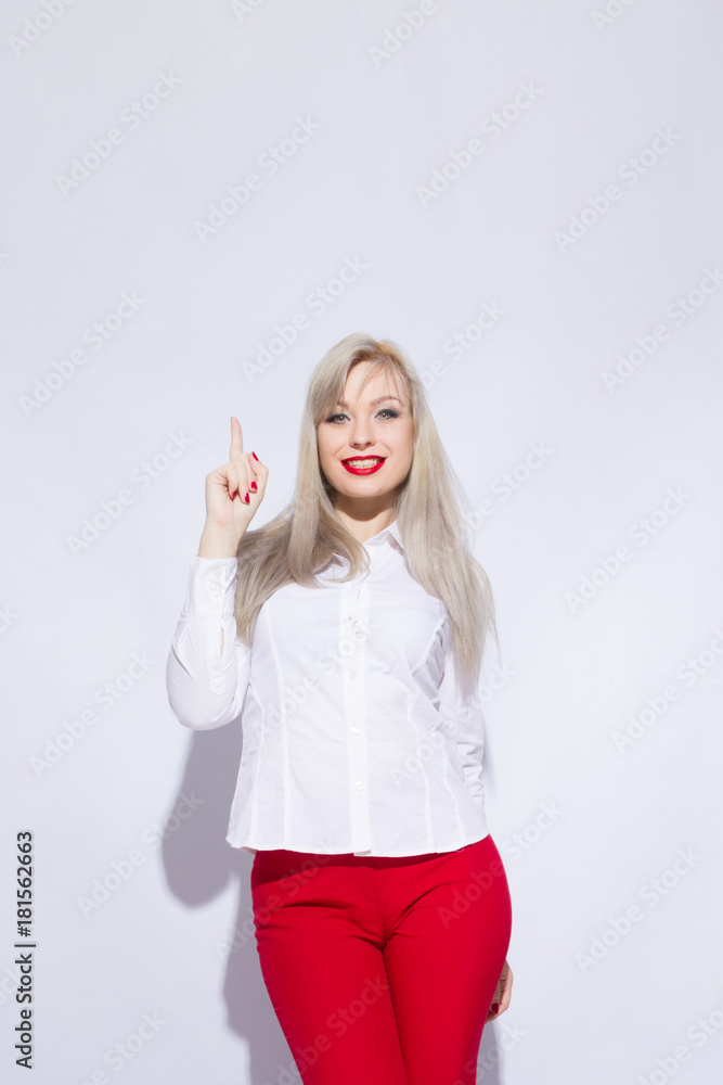 Portrait of a beautiful sexy blond woman with bright makeup on white background Portrait of a beautiful sexy blond woman with bright makeup on white background