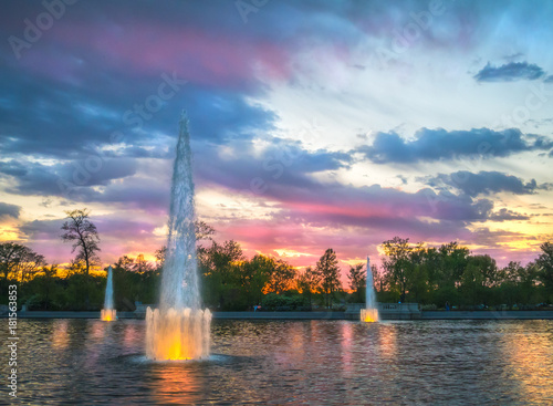 Dreamy water fountain landscape at sunset in Forest Park, St Louis