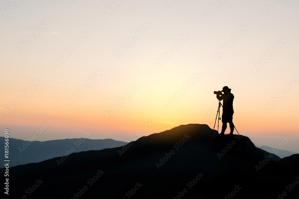 Silhouette photographer on top of mountain - obrazy, fototapety, plakaty 