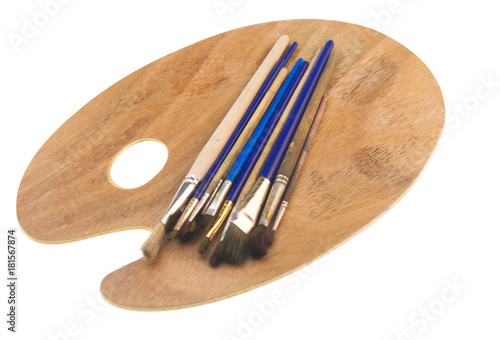 Paint brushes and artist palette, isolated on white background.