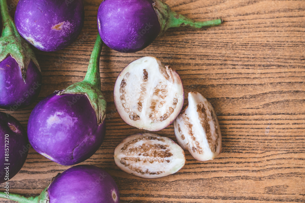 Fresh Purple eggplants on wooden table. Fresh Purple eggplants on wooden table.