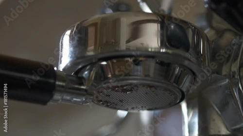 Close up of Espresso machine brewing coffee for morning breakfast. photo