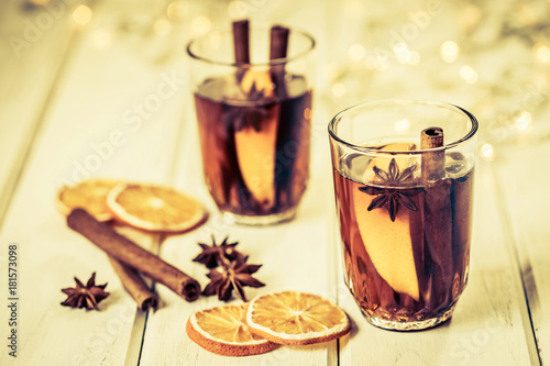 the Mulled wine in night celebration of New Year party and delicious Christmas drink for autumn and winter season