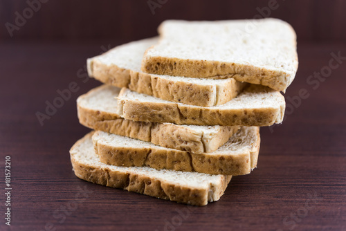 Wallpaper Mural Sliced Whole wheat bread on wood table Torontodigital.ca