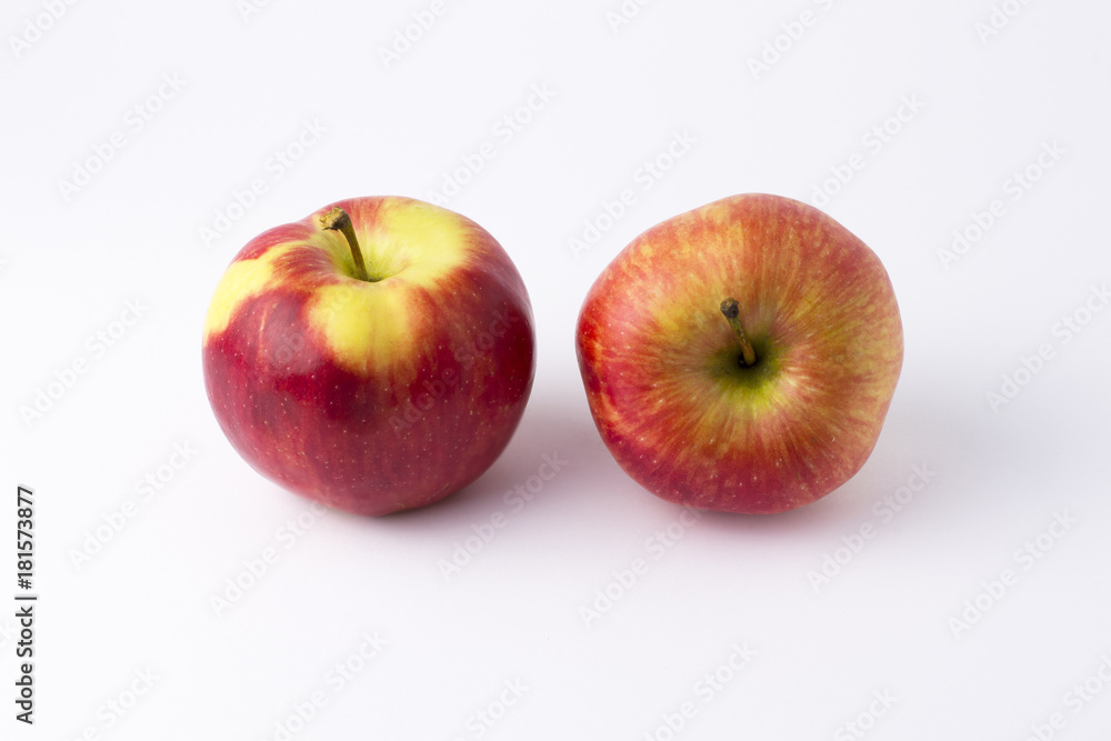 Apples on a white background. A group of apples on an isolated white background. Fruits on a white background.. Apples on a white background. A group of apples on an isolated white background. Fruits on a white background..