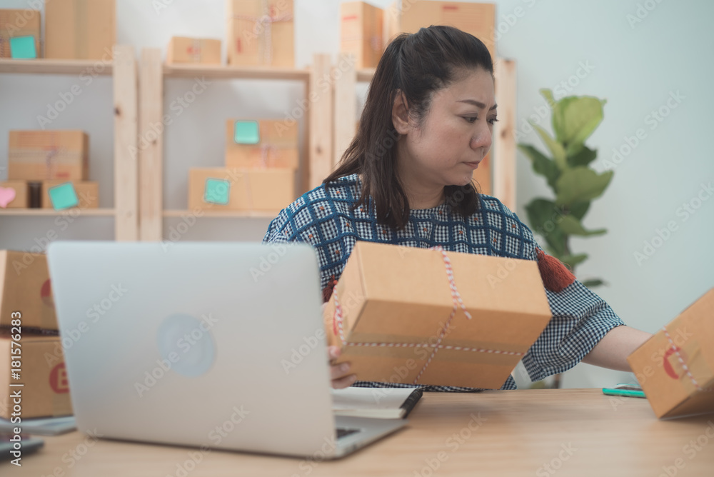 Asian woman working on laptop at home office. Close up portrait girl with computer laptop on table. Business woman selling online. Asian woman working on laptop at home office. Close up portrait girl with computer laptop on table. Business woman selling online.