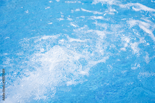 Blue clear fresh Water in jacuzzi. Spa massage background.