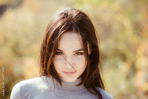Woman face with makeup on sunny day