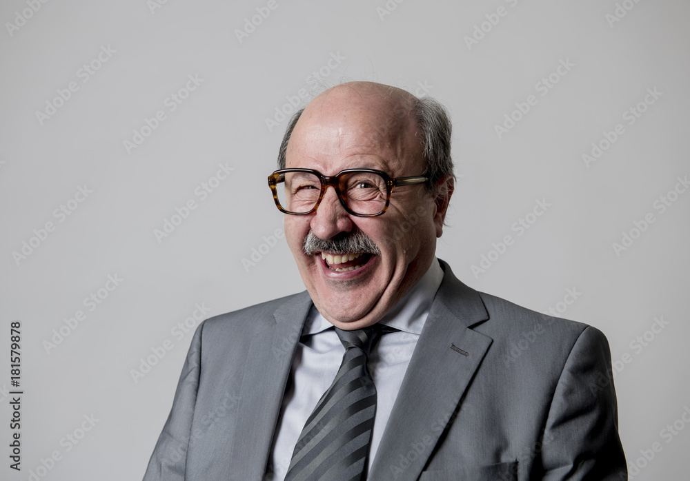 portrait of 60s bald senior happy business man gesturing funny and comic in laughter and fun face expression looking happy portrait of 60s bald senior happy business man gesturing funny and comic in laughter and fun face expression looking happy