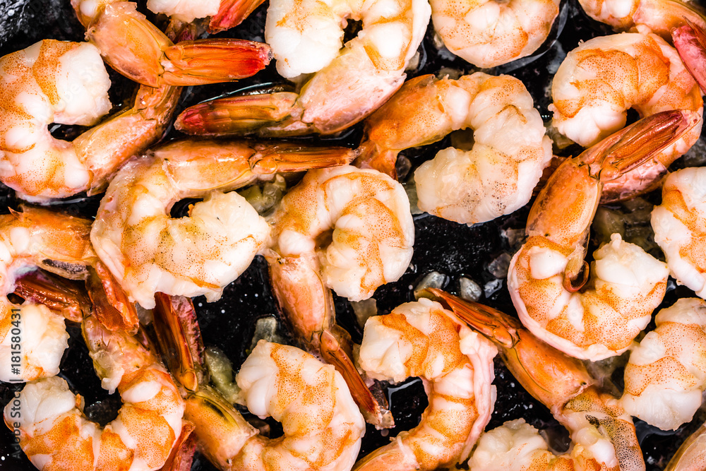 Fried shrimp with garlic on pan, preparing dish with seafood, mediterranean cuisine concept Fried shrimp with garlic on pan, preparing dish with seafood, mediterranean cuisine concept