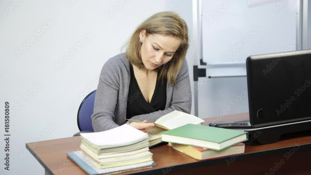 female student does homework in front of laptop female student does homework in front of laptop