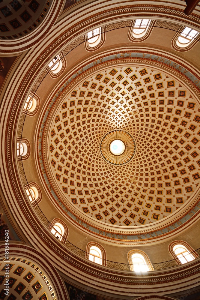 The patterned domed ceiling inside the Rotunda of Mosta, Malta.