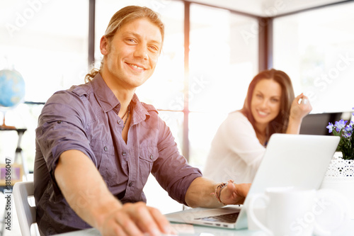 Wallpaper Mural Handsome businessman working at computer Torontodigital.ca