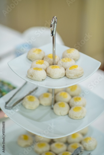 Wallpaper Mural Chinese Pastry. Dessert Chinese pastry or mooncake with salted egg yolk dessert on three tiered for holiday party at tropical restaurant.. Serving bowl with sweets and cookies for a high tea.   Torontodigital.ca