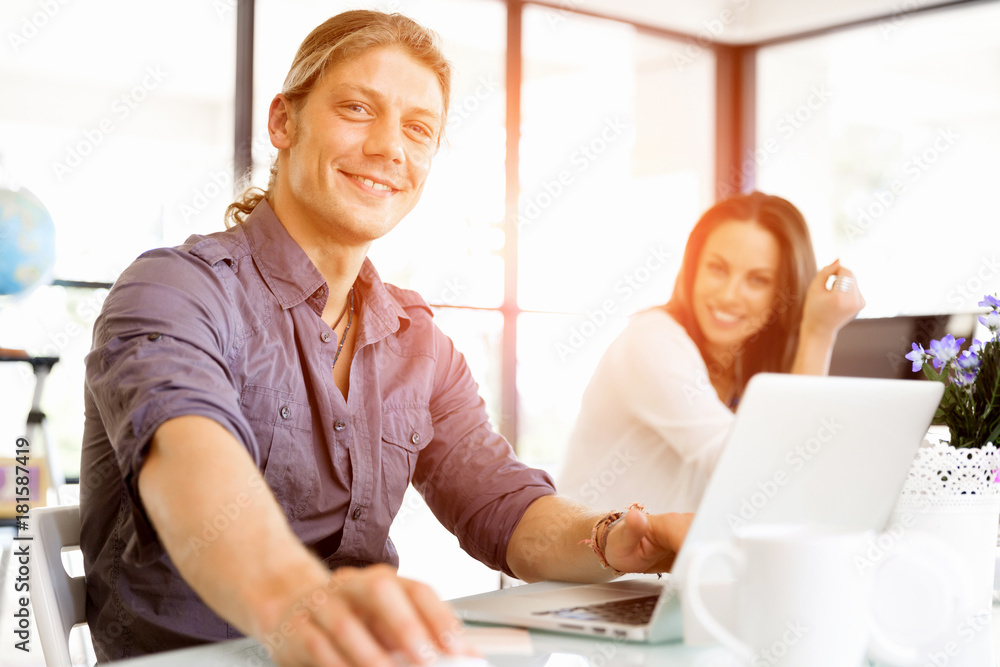 Handsome businessman working at computer Handsome businessman working at computer