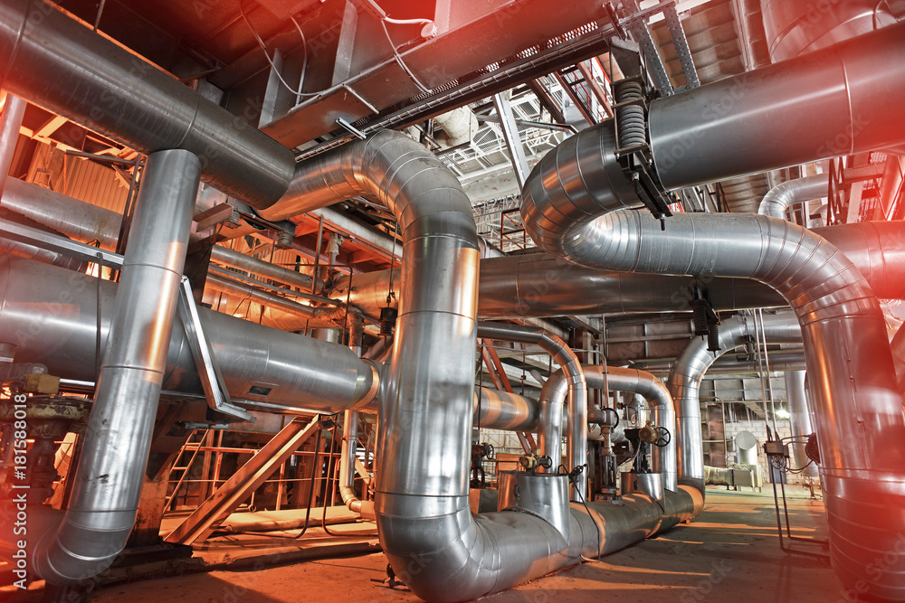 Equipment, cables and piping as found inside of a modern industrial power plant