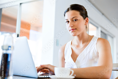 Young beautiful woman working on her laptop