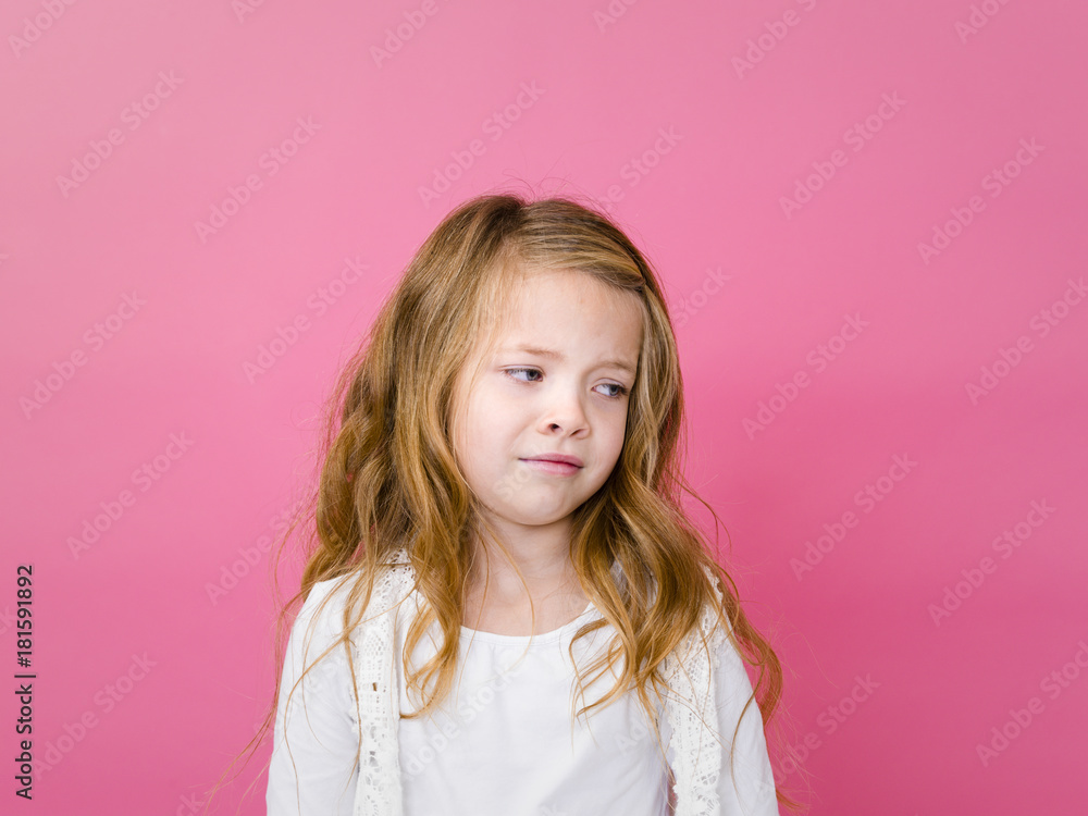 portrait of blond pretty girl in front of pink background with different emotions in the studio portrait of blond pretty girl in front of pink background with different emotions in the studio