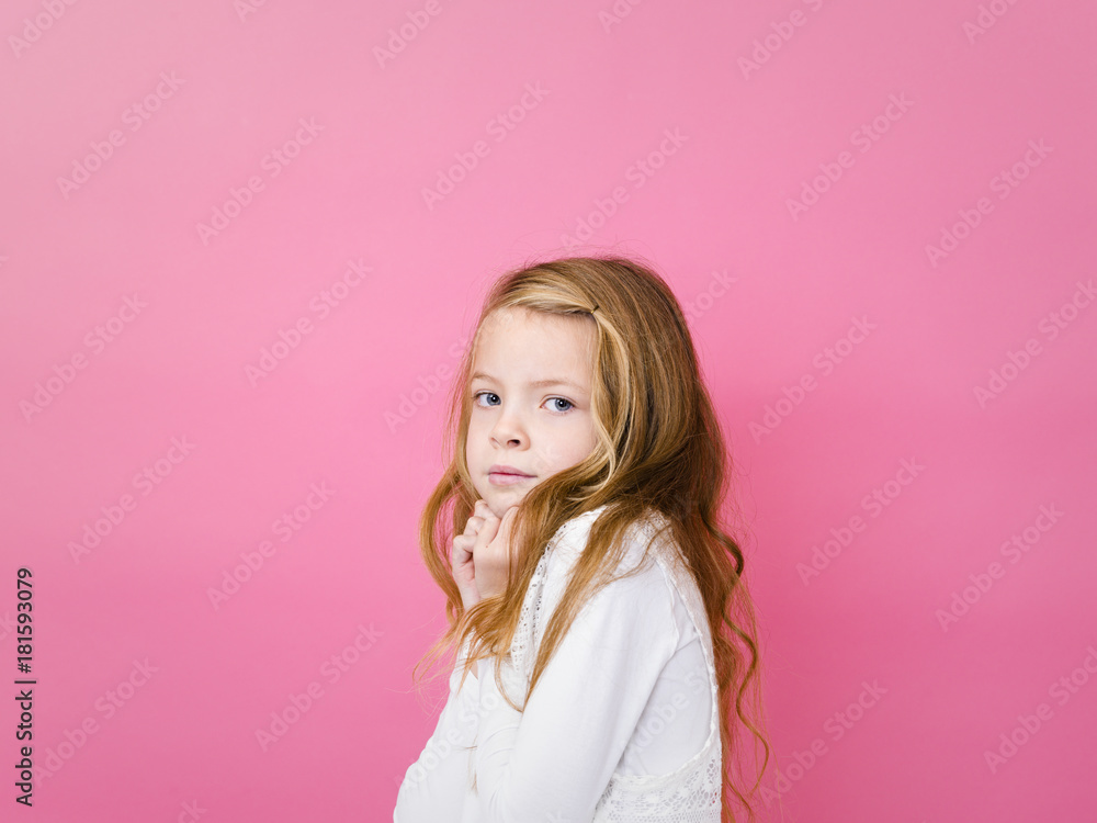 portrait of blond pretty girl in front of pink background with different emotions in the studio portrait of blond pretty girl in front of pink background with different emotions in the studio