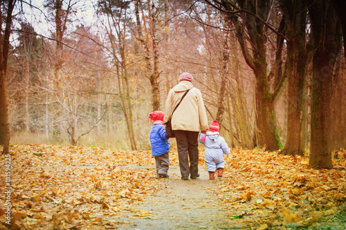 grandmother with kids walk in nature