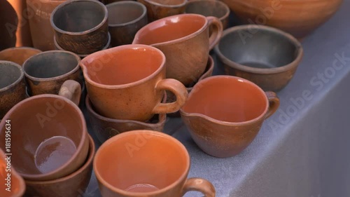 clay kitchen utensils at the fair of folk crafts. 4k, slow motion photo