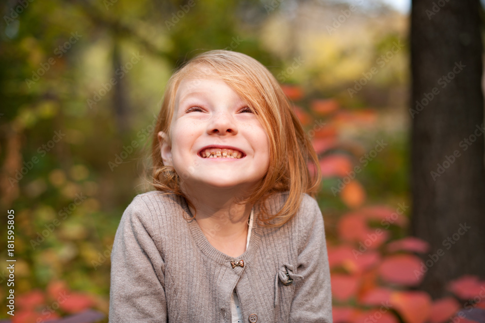 Red-haired girl in the autumn forest Red-haired girl in the autumn forest