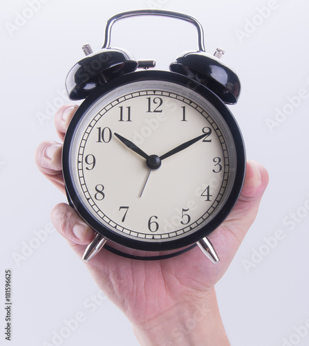 Wallpaper Mural alarm clock or alarm clock with hand on the background. Torontodigital.ca