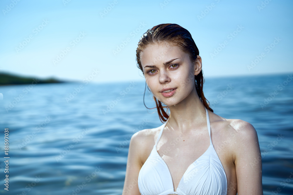 Beautiful young woman is resting on the sea, beach, summer, sun, vacation Beautiful young woman is resting on the sea, beach, summer, sun, vacation