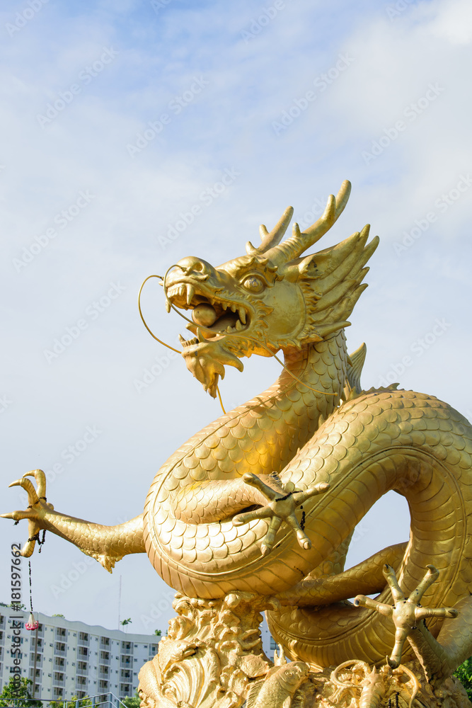 Chinese dragon statue in the mouth with glass balls On the blue sky  background Stock Photo | Adobe Stock