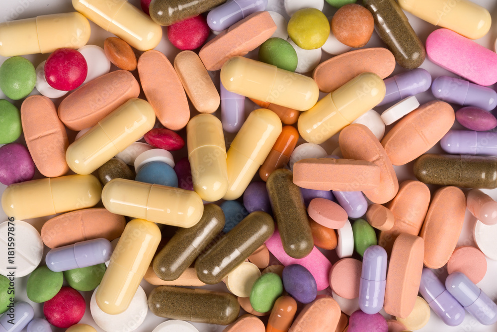 many colorful pills close-up from above many colorful pills close-up from above