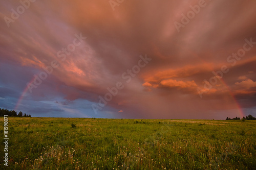 Rainbow in summer in the field © Sergei Malkov