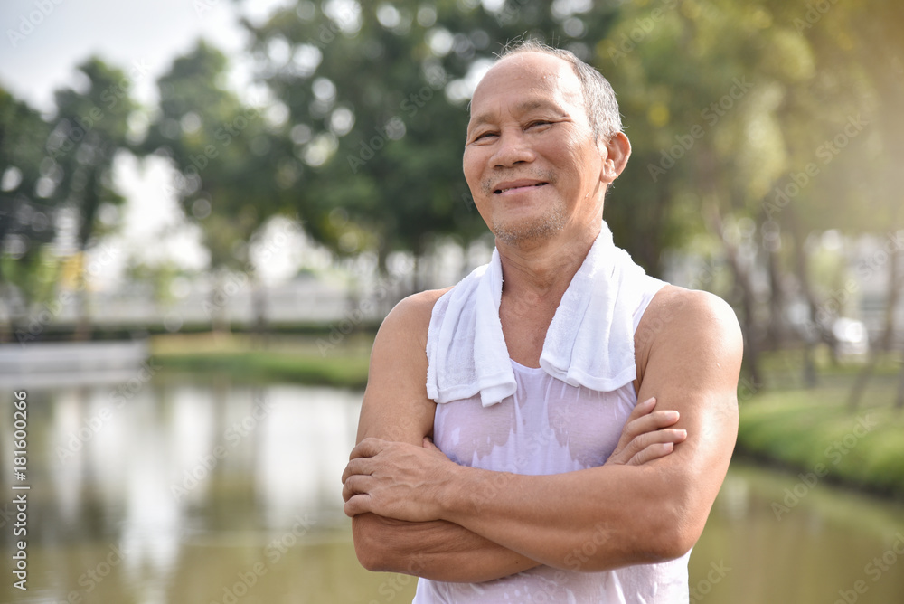 Asian Senior male posing with arms crossed. Asian Senior male posing with arms crossed.