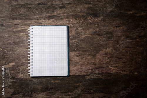 blank paper and on old wooden table photo