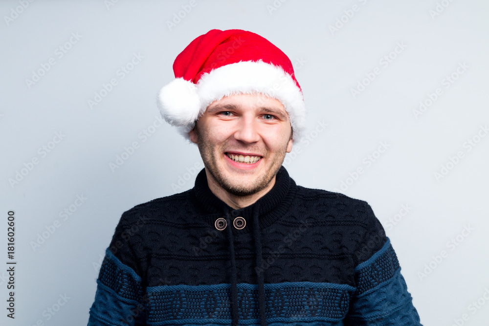 Christmas New Year happy man in Santa Claus hat depicts various emotions Christmas New Year happy man in Santa Claus hat depicts various emotions
